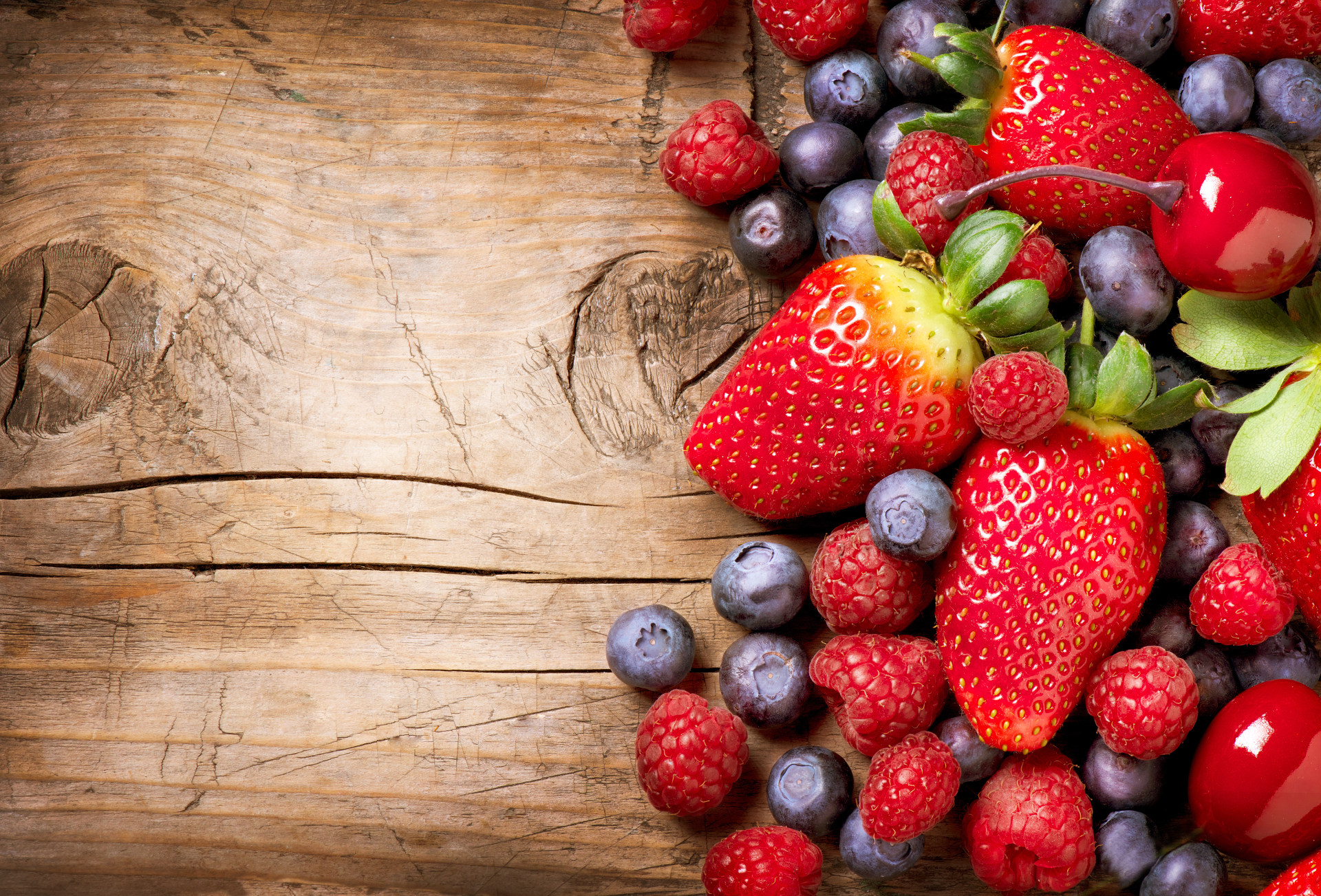 bigstock-berries-on-wooden-background-42586828_